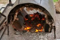 A handmade oven for heating metal blanks