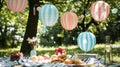 Handmade paper lanterns in the shape of balloons add a touch of whimsy and charm to the picnic