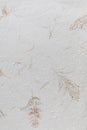 Handmade paper texture with recycled materials. Royalty Free Stock Photo