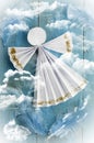 Handmade paper white angel on blue cloudy background Royalty Free Stock Photo