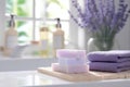 Handmade pastel purple lavender soap in white sunny bathroom. Home made spa, skincare and cosmetology concept