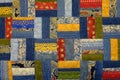 The handmade patchwork made of pattern of blue denim, colorful patchwork and lace tapes