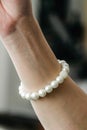 Handmade pearl bracelet on the forearm