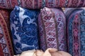 Handmade pillows in colorful embroidered pillowcases for sale at local market