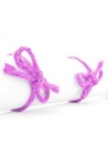 Handmade pink rope knots tied on white paper roll isolated Royalty Free Stock Photo