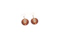 Handmade polymer clay earrings with tiger skin patterns isolated on white background. Female accessories, decorative ornaments