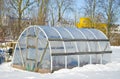 Handmade polythene greenhouse for vegetable in winter on snow Royalty Free Stock Photo