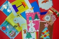 Handmade postcards and photos of children from the shelter are laid out in a circle. Charity. New Year and Christmas concept. The