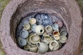 Handmade pottery pieces in earthen firing chamber of a primitive pit kiln Royalty Free Stock Photo