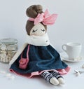 Handmade rag doll with pale cute pink bow