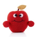 Handmade red apple puffy in knitted puppet toy with funny face. Generative AI