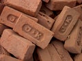 Handmade red bricks with the manufacturer's brand