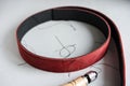 Handmade Red Leather Belt sewing with awl Royalty Free Stock Photo