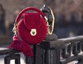 Handmade red textile knitted bag with shiny threads