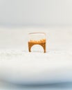 Handmade resin and wood ring standing in white snow