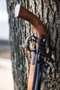 Handmade rifle of a Chinese minority resting against a tree