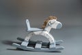 Handmade rocking horse on a gray background