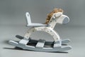 Handmade rocking horse on a gray background