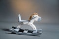 Handmade rocking horse on a gray background