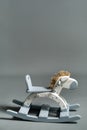 Handmade rocking horse on a gray background