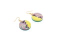 Handmade round polymer clay earrings isolated on white background. Female accessories, decorative ornaments and jewelry