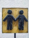 Handmade sign with a man and a woman on it Royalty Free Stock Photo