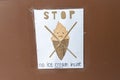 Handmade sign posted at a store reads Stop No Ice Cream Inside Sorry. Customers must eat their ice cream cones outside before Royalty Free Stock Photo