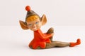 Handmade sitting elf figurine in red and brown