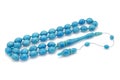 Sky blue bakelite rosary prayer beads isolated on white