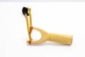 Handmade slingshot catapult. Y-shaped wooden stick with elastic tied between two top parts. Slingshot or Catapult is device for Royalty Free Stock Photo