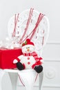 Handmade snowman and red gift box