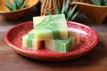 handmade soap bar with aloe vera chunks inside, placed on a ceramic dish Royalty Free Stock Photo