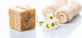 Handmade soap bar and chamomile on white background Royalty Free Stock Photo