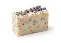 A handmade soap bar featuring embedded lavender (Lavandula) buds is displayed Royalty Free Stock Photo
