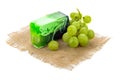 Handmade soap bar with green grapes isolated on a white background Royalty Free Stock Photo