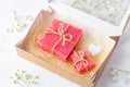 Handmade soap bars in a carton box with sisal and a wooden heart