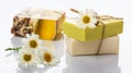 Handmade soap bars and chamomile on white background Royalty Free Stock Photo