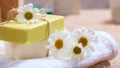 Handmade soap bars and chamomile on wooden background Royalty Free Stock Photo