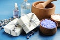 Handmade soap bars with lavender flowers and ingredients on blue wooden table Royalty Free Stock Photo