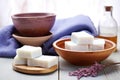 handmade soap bars next to a fresh bowl of water