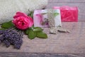 Handmade Soap with bath and spa accessories. Dried lavender and nostalgic pink rose Royalty Free Stock Photo