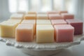handmade soap display, pastel handmade soap bars elegantly displayed on a white dish against a serene backdrop Royalty Free Stock Photo