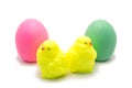 Handmade soap in the form of yellow chickens and colored eggs on a white