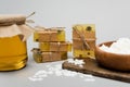 Handmade soap near blurred wax and Royalty Free Stock Photo