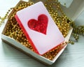 Handmade soap in the shape of a heart on a white Royalty Free Stock Photo