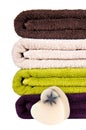 Handmade soap and stacked colorful towels Royalty Free Stock Photo