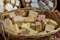 Handmade soap stacked in wicker basket Royalty Free Stock Photo