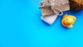 Handmade soap and yellow toy duck on a blue background. Flat lay photo, top view Royalty Free Stock Photo