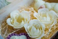 Handmade soaps in form of flowers in wooden box Royalty Free Stock Photo