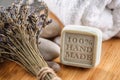Handmade soaps with lavender bunch and stones on wooden board, product of cosmetics or body care Royalty Free Stock Photo